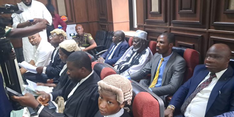 Alleged Coup: One defendant arrives in court for arraignment, five others still expected