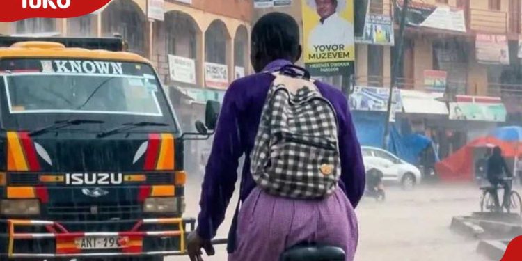 Uganda: Philanthropist offers to take young girl pictured riding bike in rain to boarding school