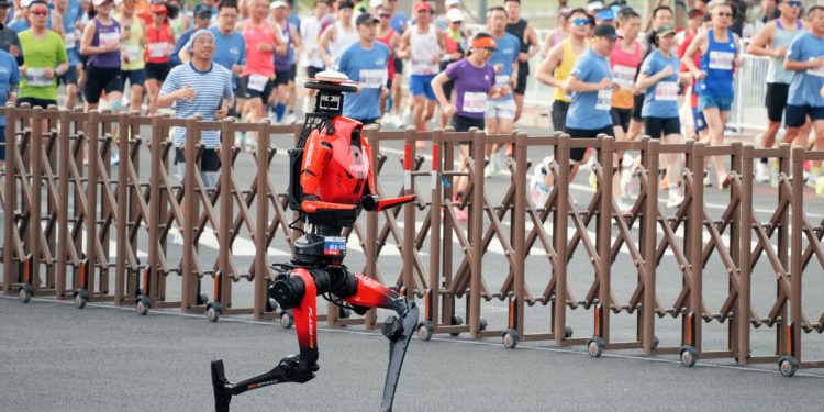 Robot named Lightning blows past human runners to set half-marathon record in Beijing